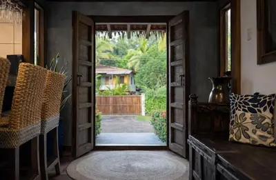 a door leading to a backyard with a yard at Paradise in Tivives
