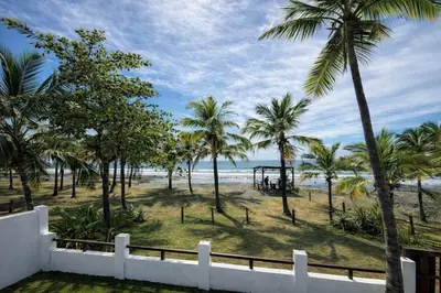 a view of a beach with palm trees and the ocean at Paradise in Tivives