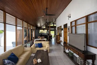 a living room with a couch and a flat screen tv at Paradise in Tivives