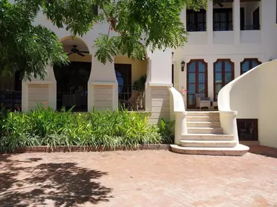 a building with a staircase in front of it at LC Casa Olas in Playa Danta