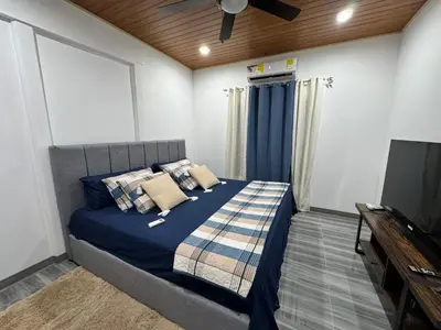 a bedroom with a bed and a flat screen tv at Harol reyes in Liberia