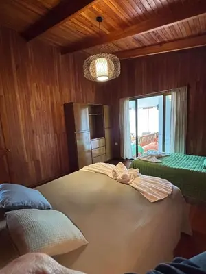 a bedroom with a large bed in a room at Casa 1440 in Monteverde Costa Rica