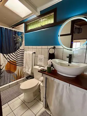a bathroom with a sink and a toilet at Casa 1440 in Monteverde Costa Rica