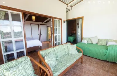 a living room with a couch and a bed at Casa 1440 in Monteverde Costa Rica