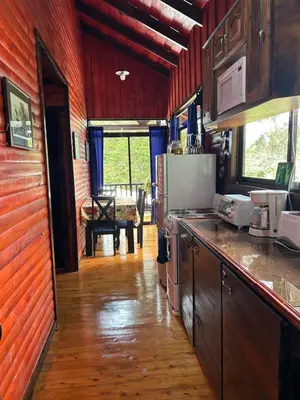 a kitchen with a counter top in a room at Cabaña de Montaña El Jardin in Jardín