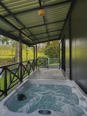 a hot tub on the porch of a house at Casa Los Cedros in Río Cuarto