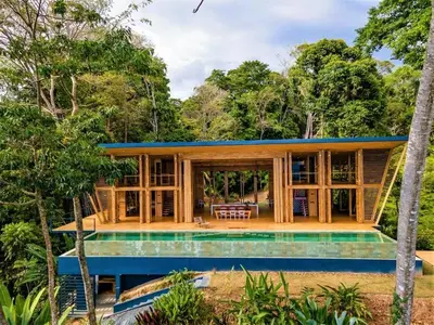 a house with a pool in front of it at The Zen, Award-Winning Sanctuary in Uvita in Uvita