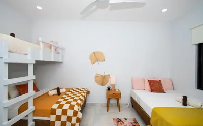 a bedroom with two beds and a bunk bed at New! 3 Bedroom Villa in Uvita, Large Pool! in Uvita