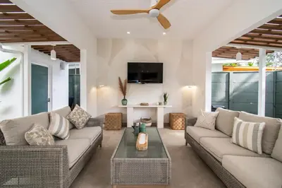 a living room with a couch and a table at NEW! Villa, 3bdrs with AC, Pool, close to Marino Ballena in Uvita