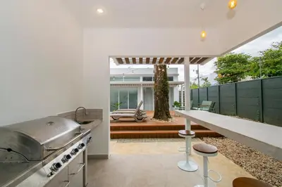 a kitchen with a stove and a counter top at NEW! Villa, 3bdrs with AC, Pool, close to Marino Ballena in Uvita