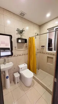 a bathroom with a toilet and a sink at Apartamento Decrusi in Alajuela City