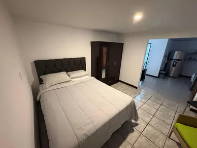 a bedroom with a large bed in a room at Floral Departments in Comunidad