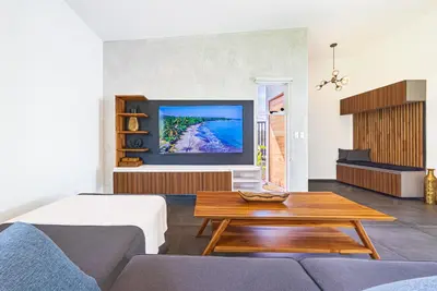 a living room with a couch and a coffee table at Villa Dos Vistas in Uvita