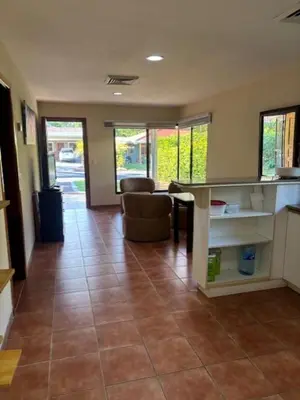 a living room with a tiled floor in a house at Los Delfines 560 in Tambor