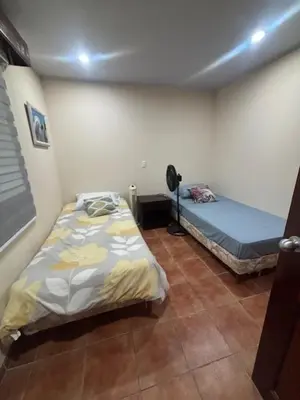 a bedroom with two beds in a room at Los Delfines 560 in Tambor