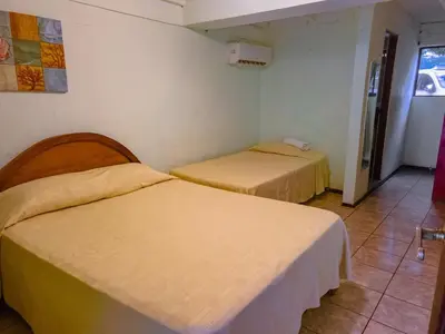 a room with two beds in a room at Casa Rector - Beach House Rental in El Roble