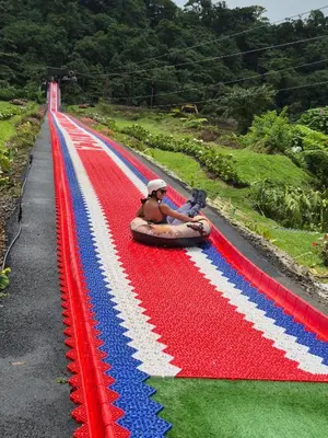 a man in a raft on a red white and blue track at Casa las Luciernagas in Bajos del Toro
