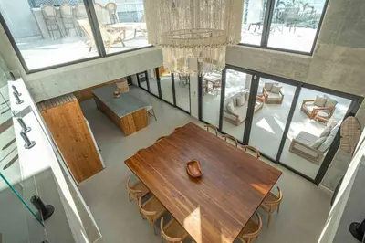 an overhead view of a dining room with a table and chairs at CASA AZUL - Luxury Beachfront Mansion in Potrero