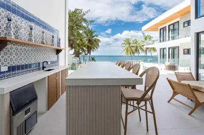 a kitchen with a view of the ocean at CASA AZUL - Luxury Beachfront Mansion in Potrero
