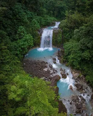 an aerial view of a waterfall in the jungle at Casa Hortensias in Bajos del Toro