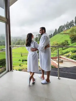 a man and a woman standing in front of a window at Casa Hortensias in Bajos del Toro