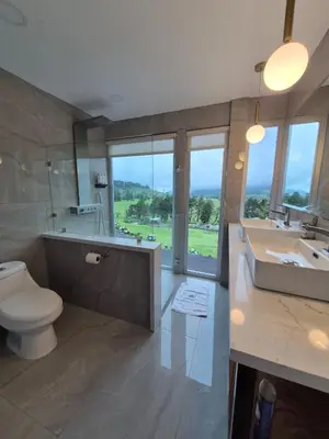 a bathroom with a toilet and a tub and a sink at Casa Hortensias in Bajos del Toro