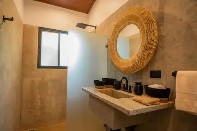a bathroom with a sink and a mirror at Selva Color - Forest & Beach EcoLodge in Quebrada Ganado