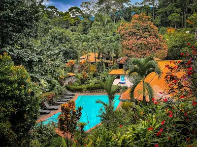 an aerial view of a resort with a swimming pool at Finca Luna Nueva Lodge in Fortuna