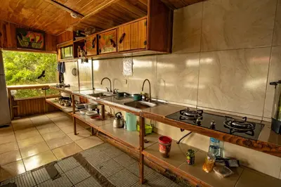 a kitchen with stainless steel counter tops and sinks at Hostel La Suerte in Monteverde Costa Rica