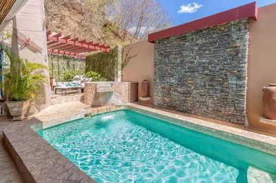 a swimming pool in the backyard of a house at Stunning Villa with Oceanview, Private Pool, Soaking Tub & Picturesque Balcony in Playa Flamingo