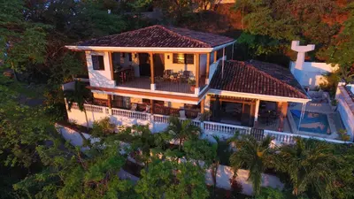 an aerial view of a house with a swimming pool at Stunning Villa with Oceanview, Private Pool, Soaking Tub & Picturesque Balcony in Playa Flamingo