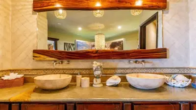 a bathroom with two sinks and a mirror at Stunning Luxury Mansion in Playa Flamingo with Six Bedrooms and Beachfront Access in Playa Flamingo