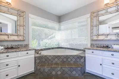 a bathroom with a tub and two sinks at Luxury Five-Bedroom Oasis in Playa Flamingo with a Private Pool and Stylish Decor in Playa Flamingo