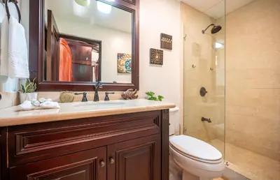 a bathroom with a sink and a toilet and a shower at Upscale Two-Bedroom Condo in Playa Flamingo with Beautiful Oceanfront Views in Playa Flamingo
