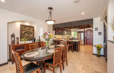 a dining room with a table and chairs at Upscale Two-Bedroom Condo in Playa Flamingo with Beautiful Oceanfront Views in Playa Flamingo