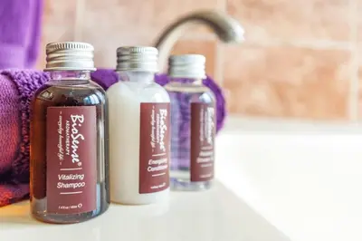 three bottles of liquid sitting on a bathroom sink at Big Hillside Villa in Potrero with Pool and Panoramic Ocean Views in Potrero