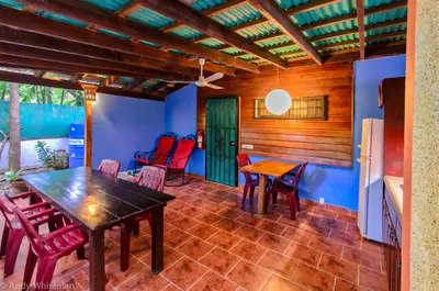 a dining room with a wooden table and chairs at Casa Smilin' Dog in Tamarindo