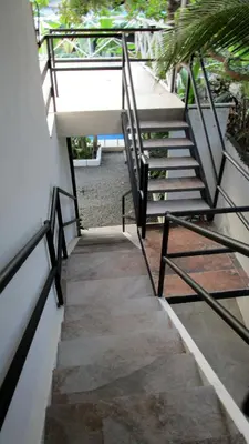 a set of stairs leading up to a building at Sueño Tranquilo in Quepos