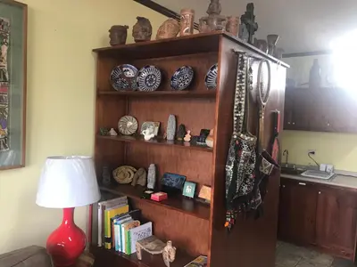 a book shelf with plates and bowls on it at Sofia Apartments in Escalante, San Jose Center in San José
