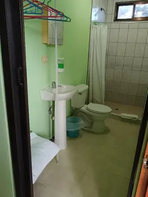 a bathroom with a sink and a toilet at Cabinas Dormi Bene in Miramar