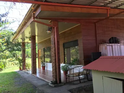 an outside view of a house with a porch at Hotel Vale's in Chiles