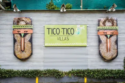 a wall with two large hot dogs in buns at Tico Tico Villas - Adult Only in Manuel Antonio