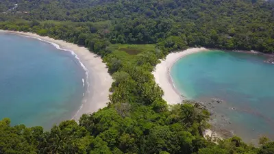 an aerial view of a beach in the ocean at Inn On The Park in Manuel Antonio