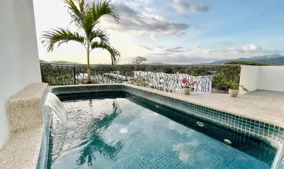 a swimming pool in a villa with a view at Luxury SKY PENTHOUSES 3-6BR Condo-Hotel at Oceano Jaco in Jacó