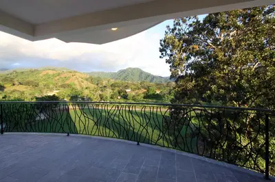 a balcony with a view of the mountains at Luxury SKY PENTHOUSES 3-6BR Condo-Hotel at Oceano Jaco in Jacó