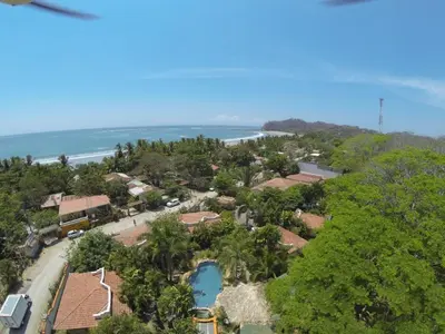 an aerial view of a resort and the ocean at Villas Kalimba in Sámara