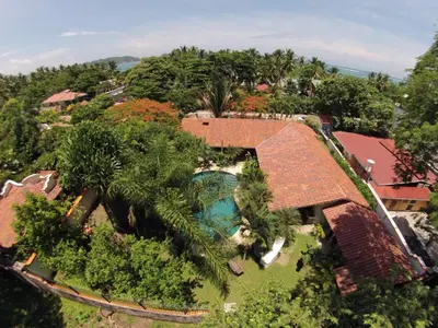 an aerial view of a house with a swimming pool at Villas Kalimba in Sámara