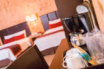 a hotel room with a coffee maker on a counter at Savegre Hotel Natural Reserve & Spa in San Gerardo de Dota