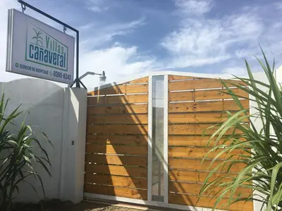 a wooden fence with a sign in front of it at Posada Cañaveral in Ujarrás