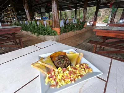 a plate of food on top of a table at Valle Encantado in San Isidro